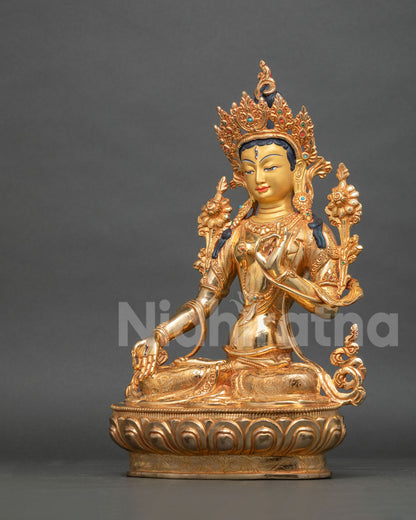 White Tara Statue ornate crown semi precious gemstones intricate gold details.
