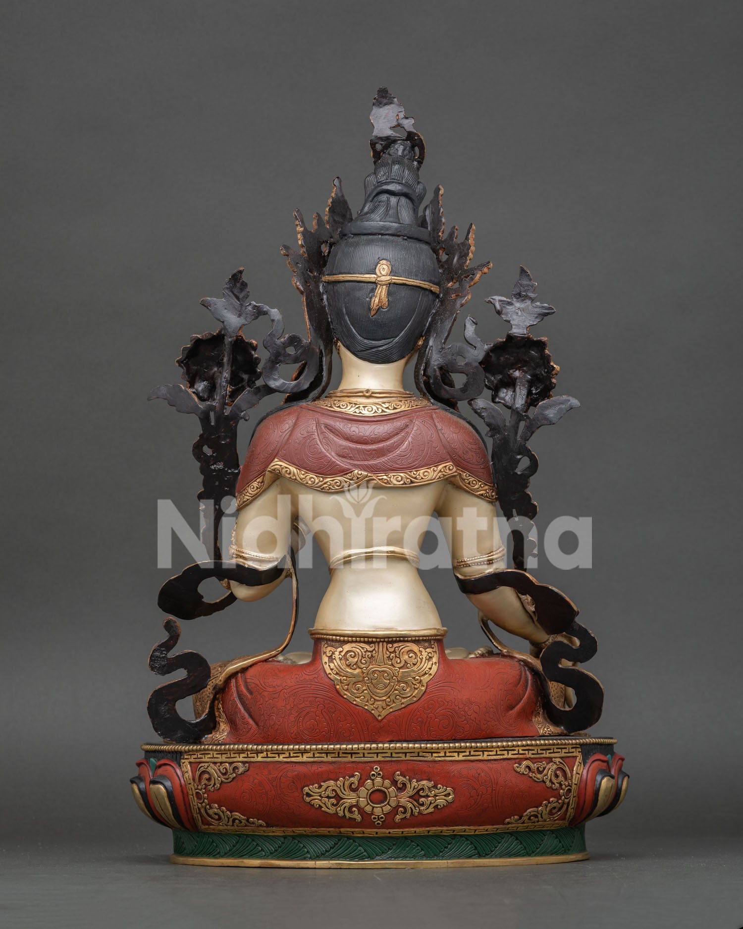 White Tara statue revealing exceptional copperwork, vibrant colors, and sacred Buddhist symbolism.