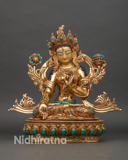 White Tara statue seated on lotus, fire-gilded gold and copper front view