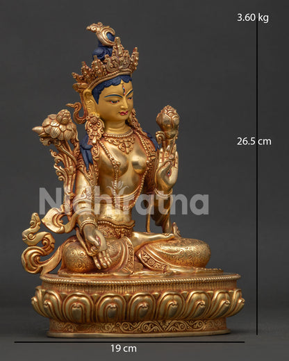 White Tara statue side view with elegant lotus seat and handcrafted Himalayan artistry.