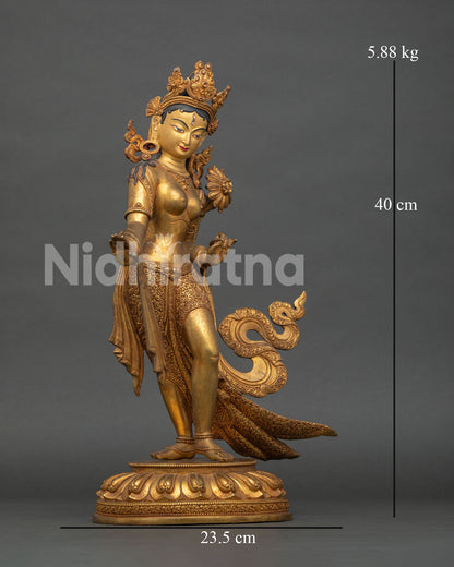 White Tara statue standing on lotus pedestal with seven eyes symbolizing compassion and healing