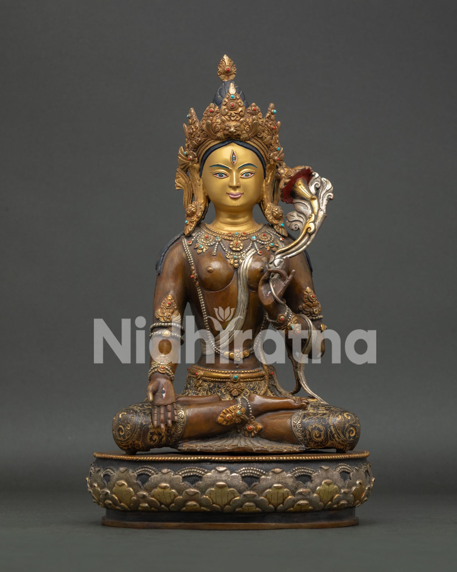 White tara statue with 24k gold painted face and silver plated copper finish.