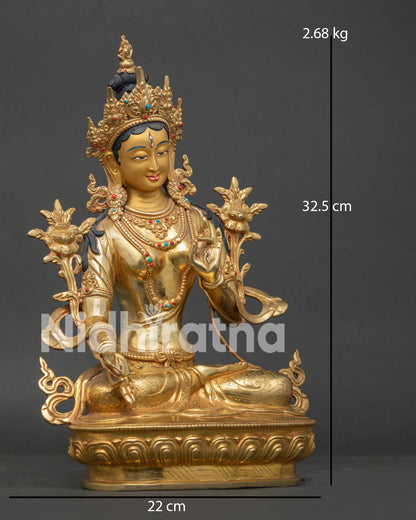 White Tara Statue with gold painted face and seven compassionate eyes.