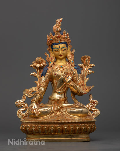 White Tara statue with seven eyes on forehead palms and soles.