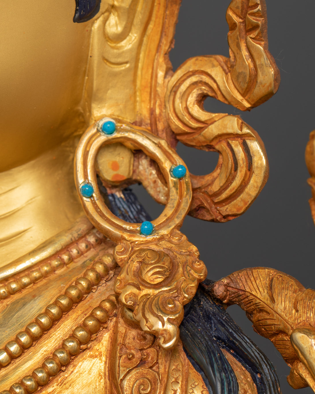 the gemstones adorned earring of white tara