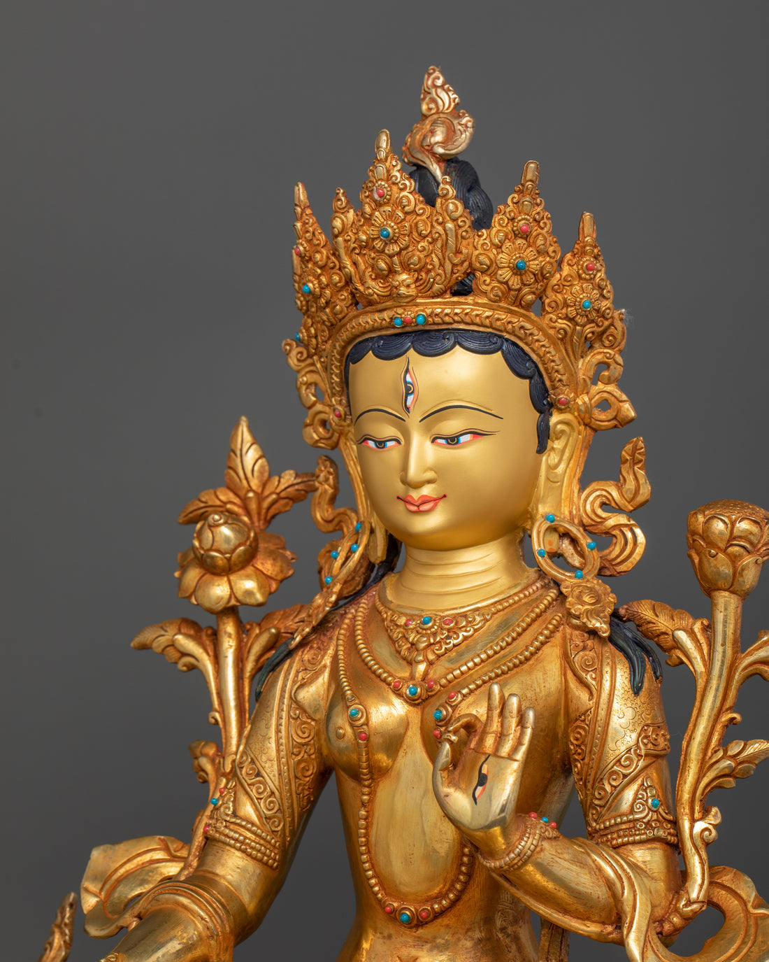 side view of white tara statue