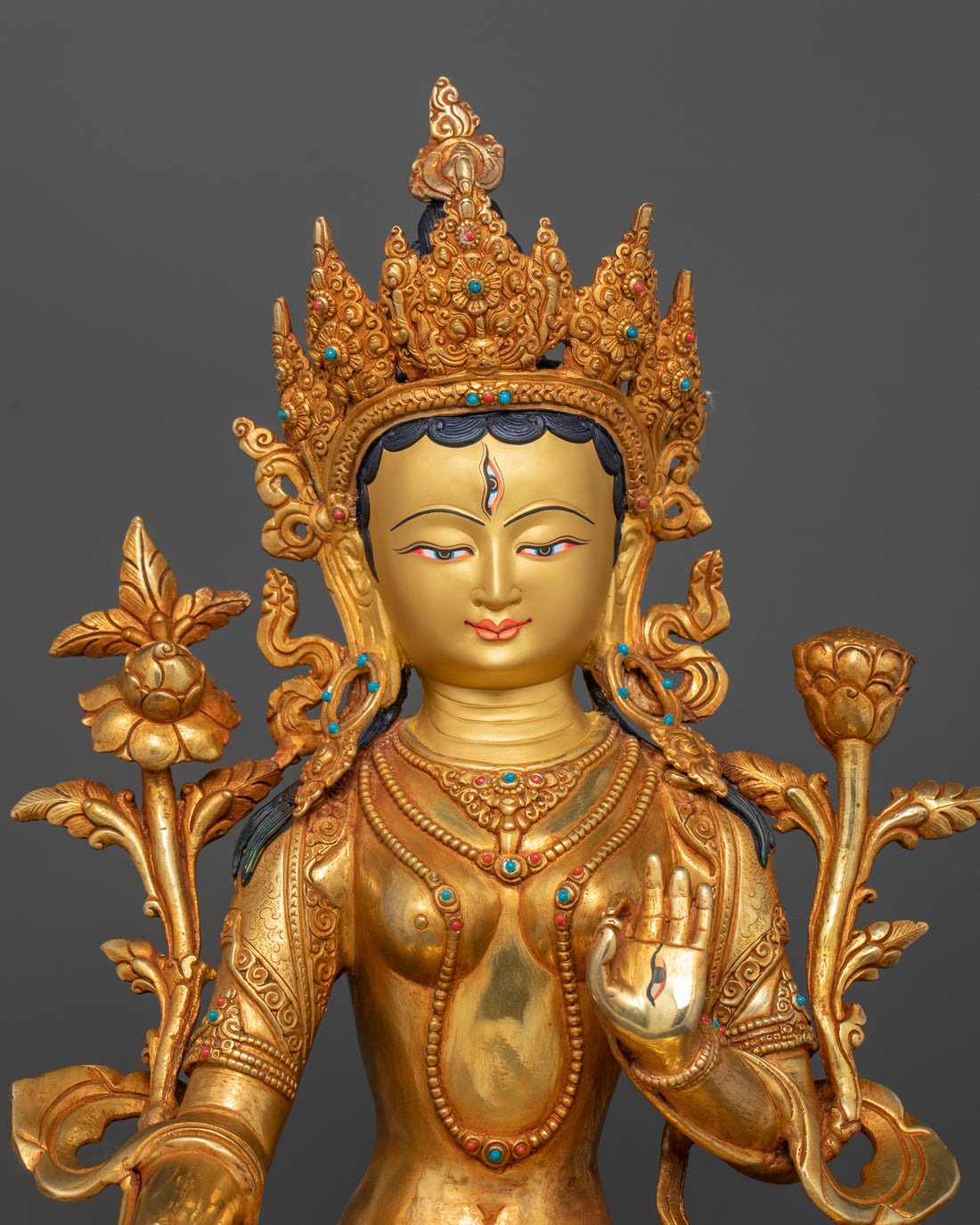 pure gold coated face of white tara gold statue