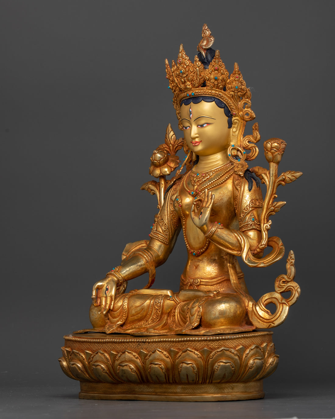 side profile of gold gilded white tara statue of weight 9.67kg