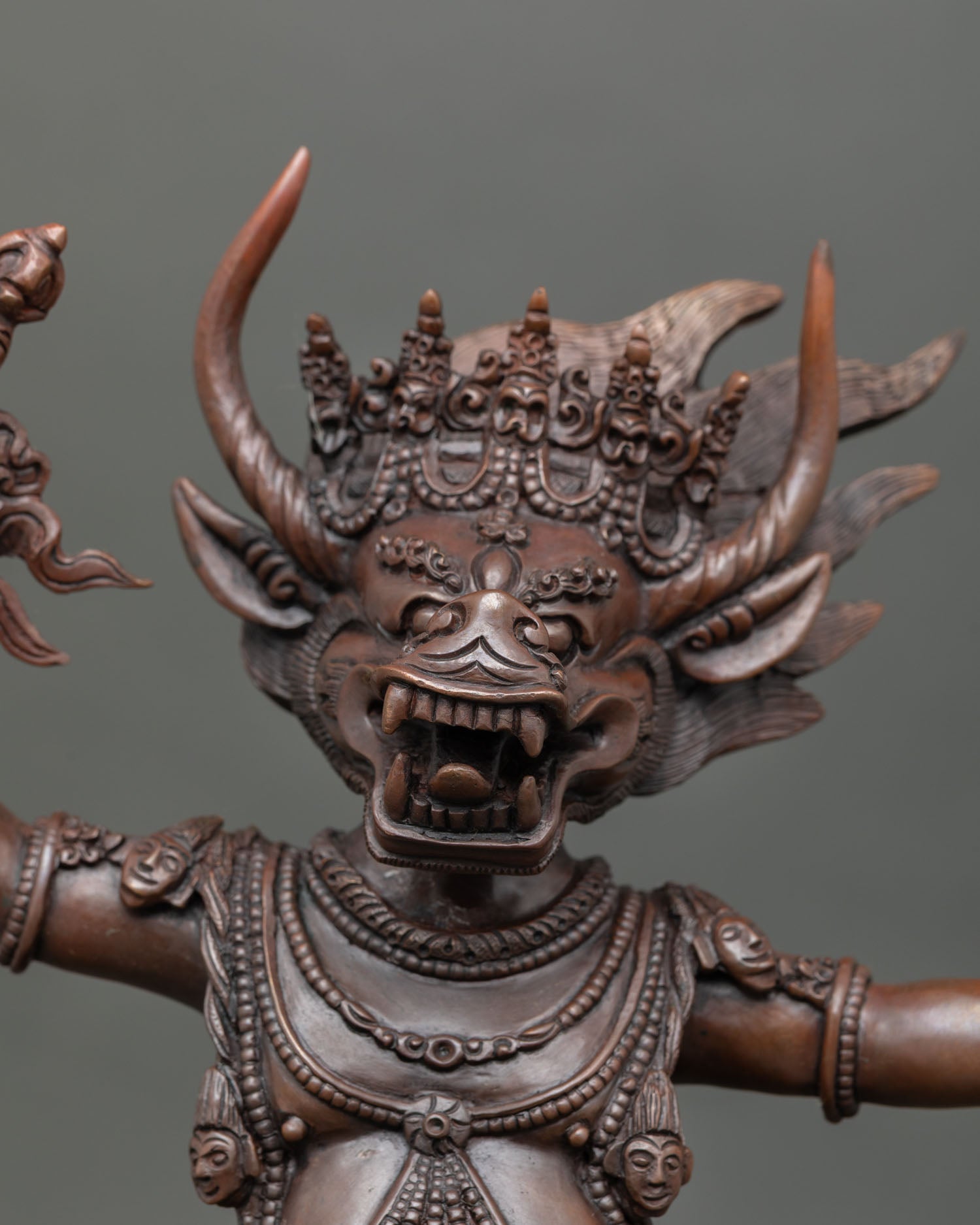 Yamantaka close up fierce expression with consort copper statue oxidized finish showing detailed craftsmanship and spiritual symbolism.