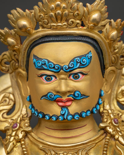 yellow dzambhala face detail 24k gold painted yellow dzambhala statue close up