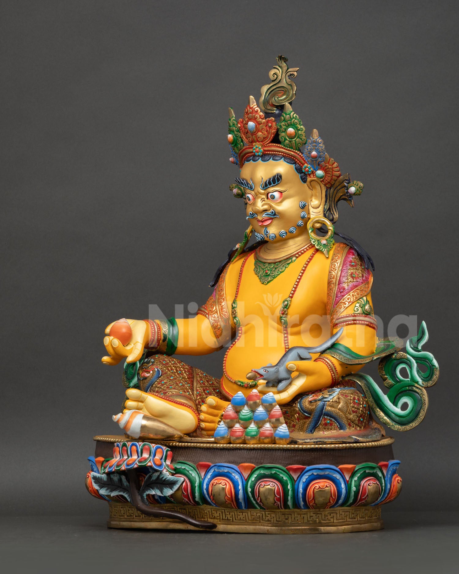 Yellow Dzambhala left side, handcrafted gold-gilded copper, mongoose and ornamental elements visible