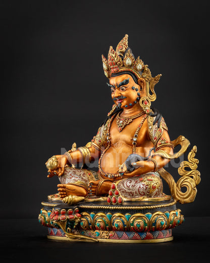 Yellow Dzambhala statue angled left view seated on lotus pedestal
