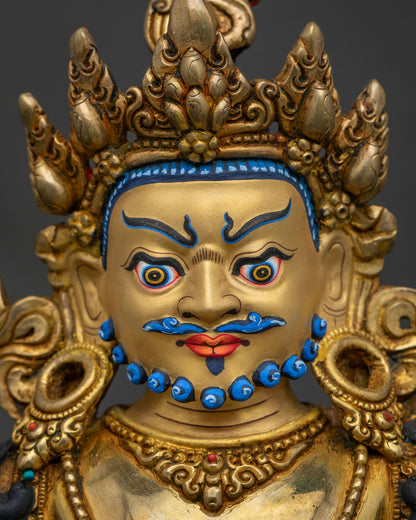 Yellow Dzambhala Statue detailed face close up with 24K gold fire gilding