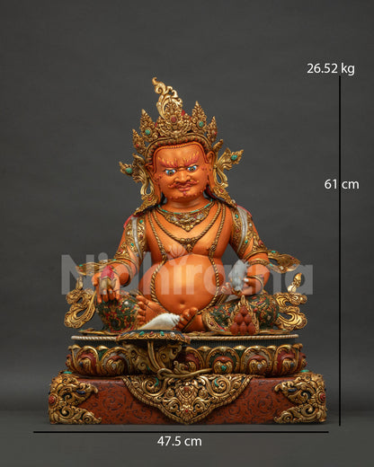 Yellow Dzambhala statue front view, handcrafted copper sculpture with gold gilding from Nepal
