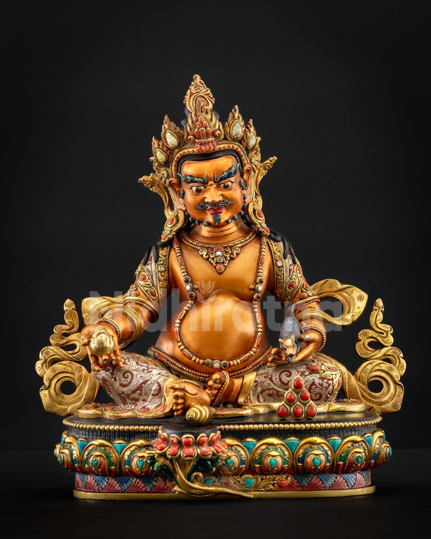 Yellow Dzambhala statue front view seated on a multicolored lotus throne