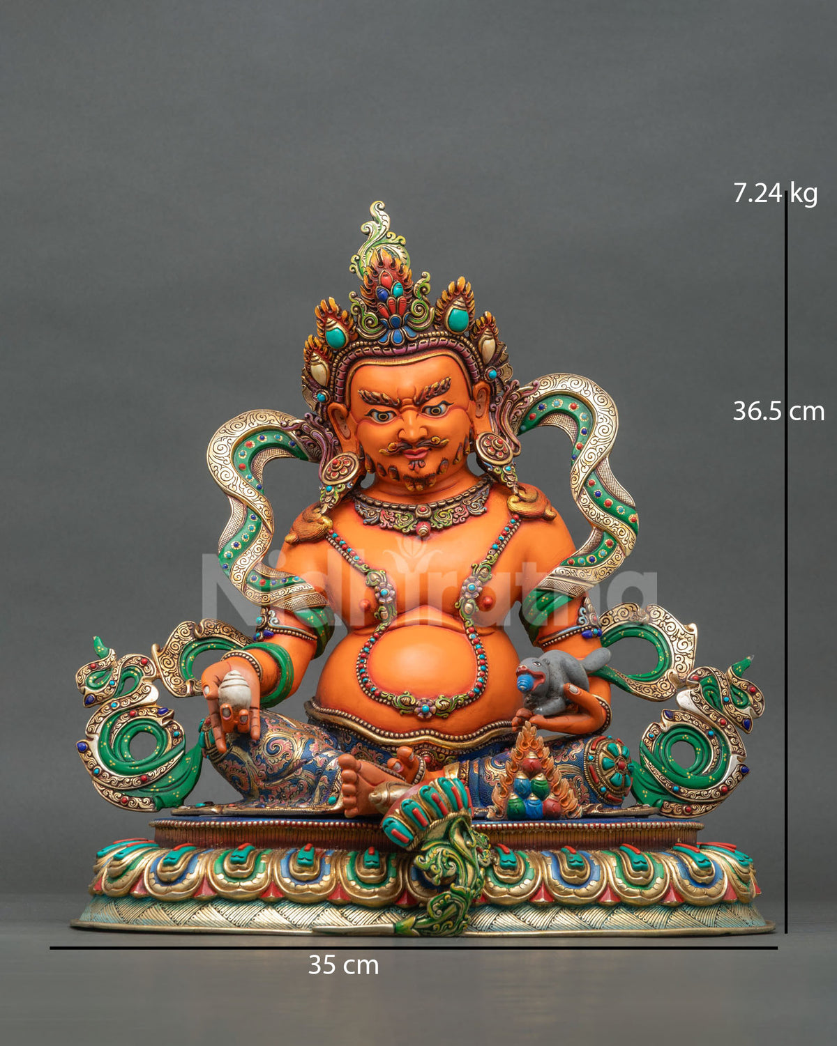 Yellow Dzambhala statue handcrafted from copper with gold gilded details and semi-precious stones by Newari artisans in Patan, Nepal.