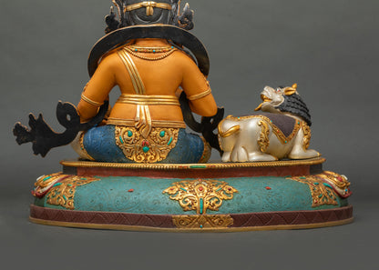 Yellow Dzambhala statue rear view handcrafted copper gold gilded prosperity deity Nepal